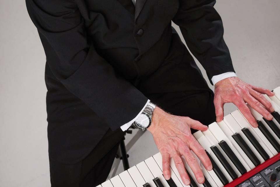 Fingers on piano