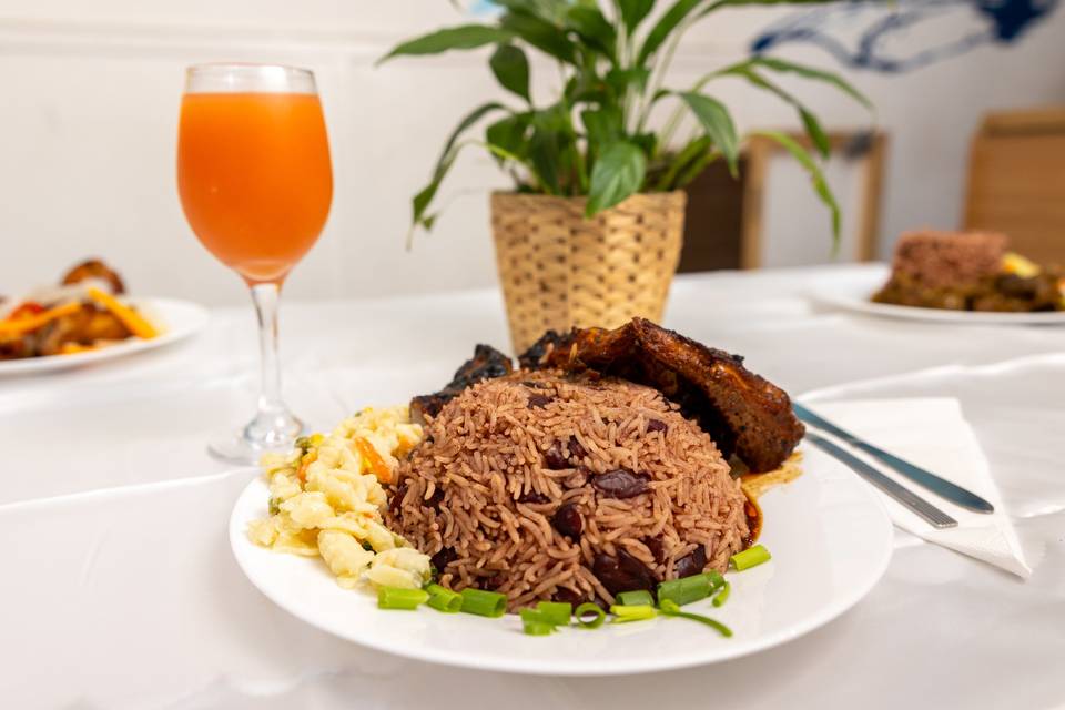 plated caribbean meal with plant setup