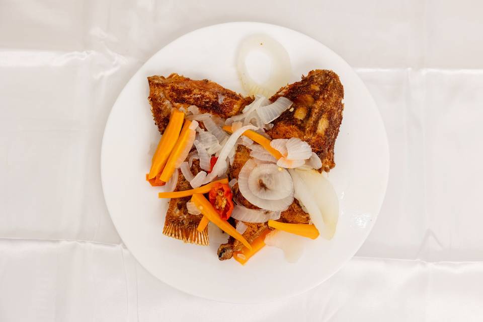 plated meat with salad and sides