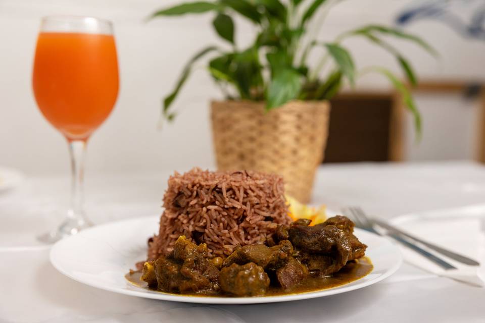plated rice dish with juice glass
