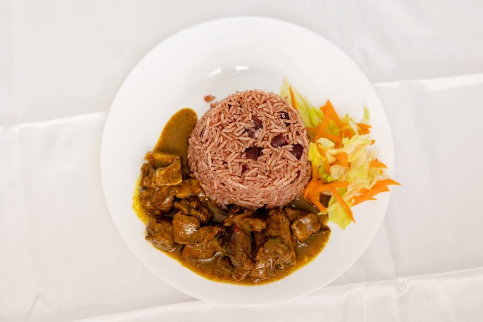 plated stew rice peas coleslaw