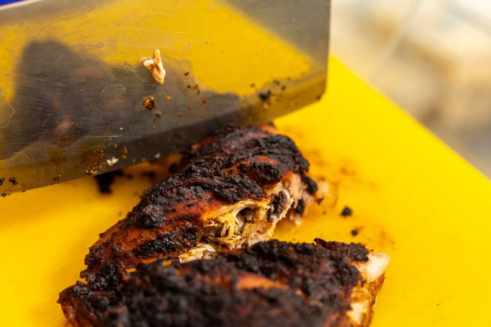 slicing cooked meat yellow cutting board