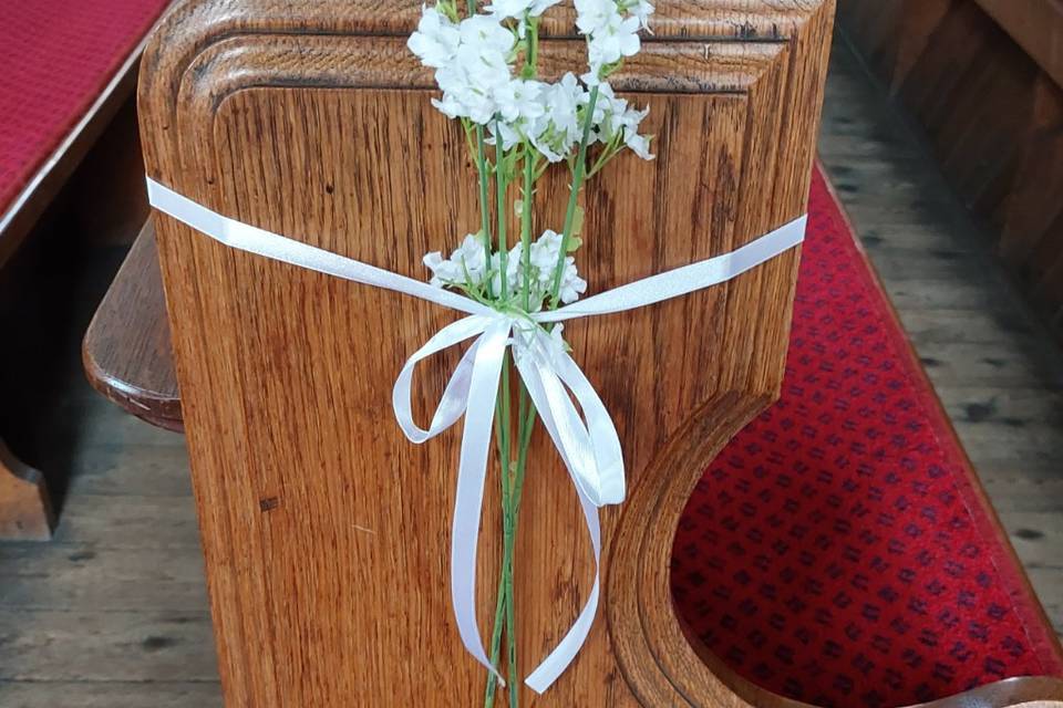 Church pew with gypsophila