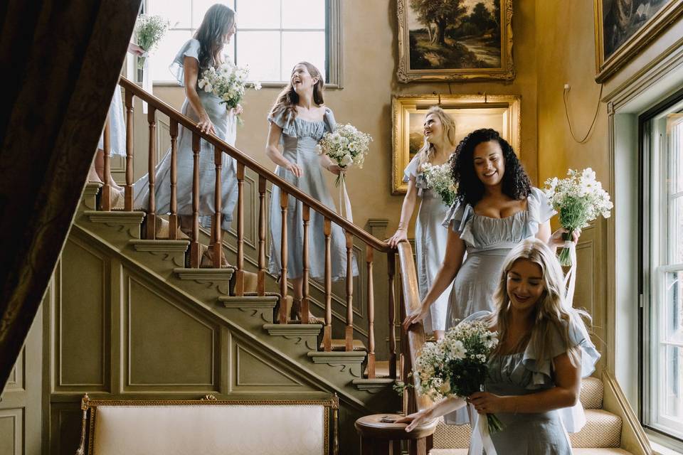 Bridesmaids on staircase