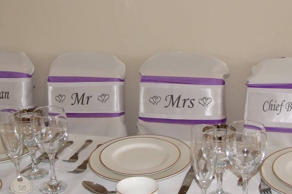 Top Table sashes shown in white on deep purple organza