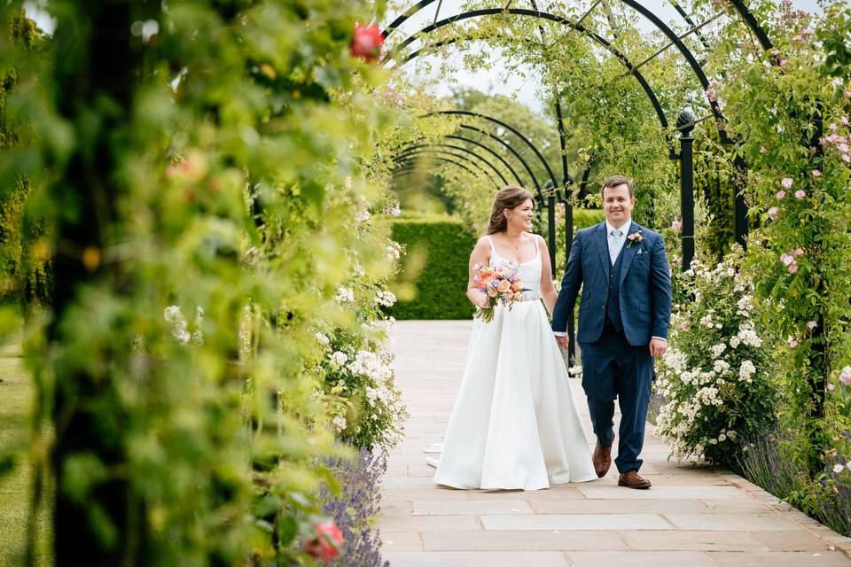 Newlyweds in the rose garden
