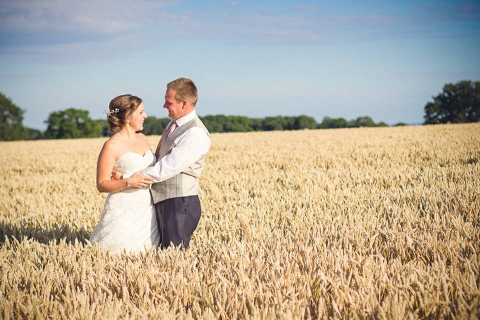 Bride and groom in cornfields