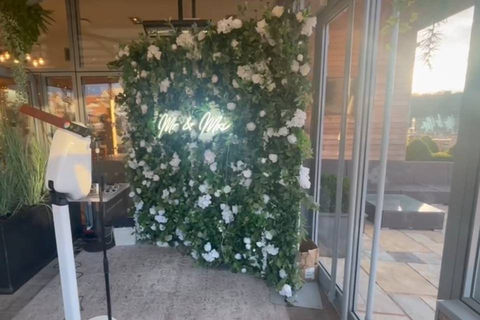Booth with floral wall