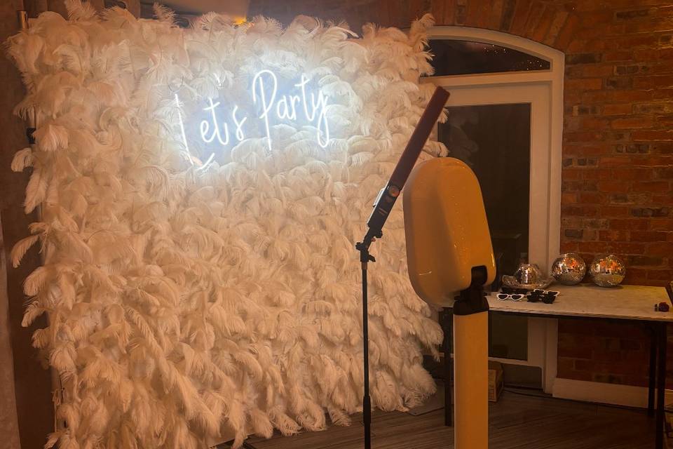 Booth with feather wall