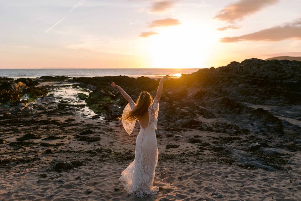 Bride dancing to the sunset