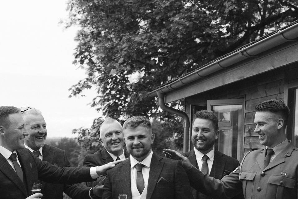 Groomsmen toasting their groom