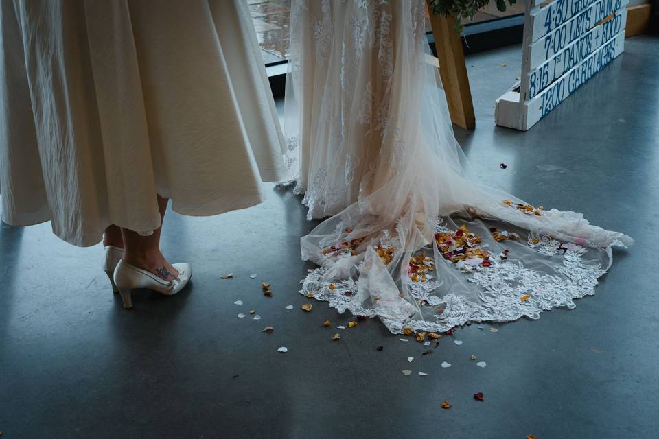 Bridal gowns trailing confetti