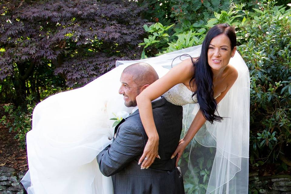 Groom carrying the bride