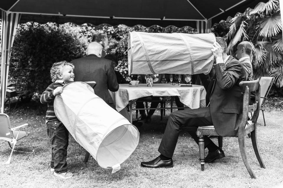 Groom playing with child