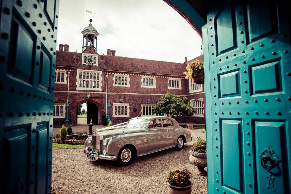 Wedding car against blue doorway