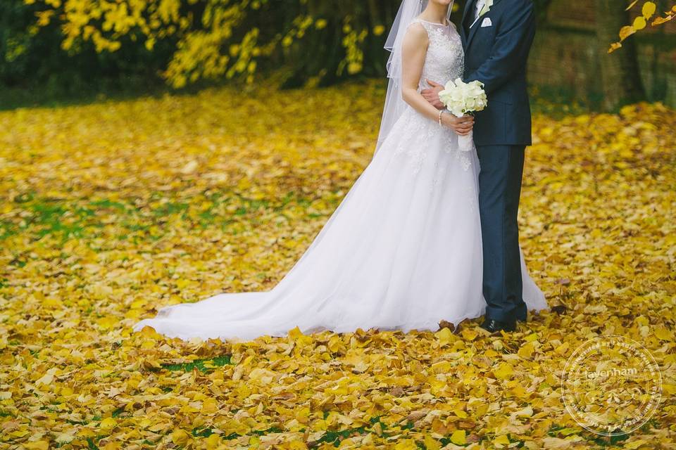 Bride & Groom in Autumn leaves