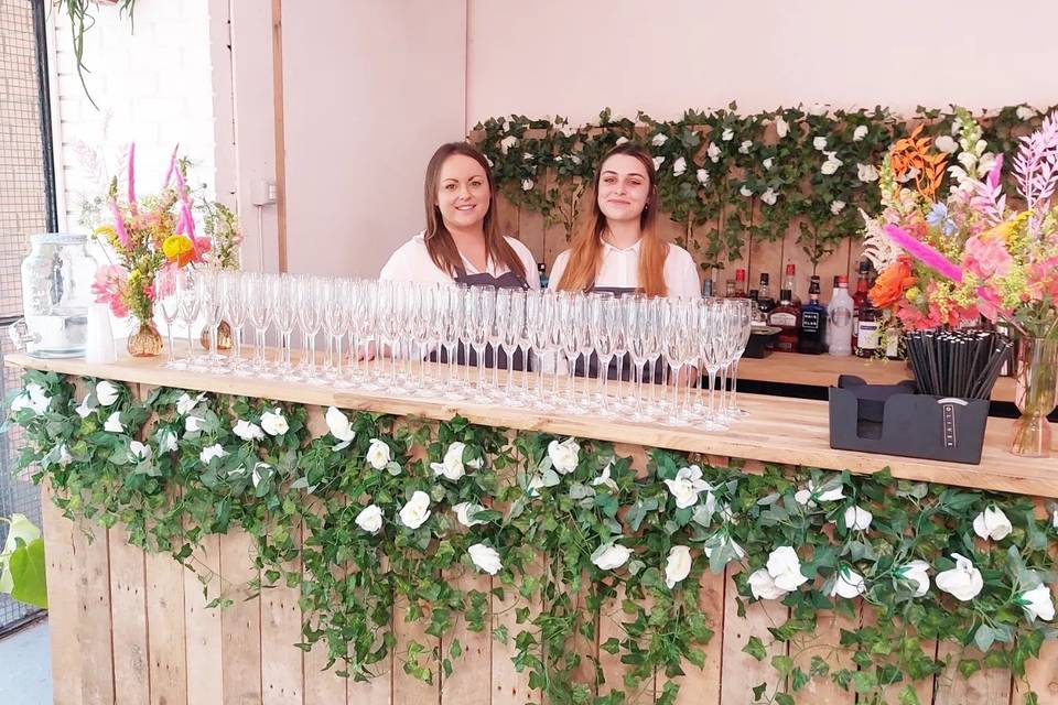 Pallet bar with faux foliage