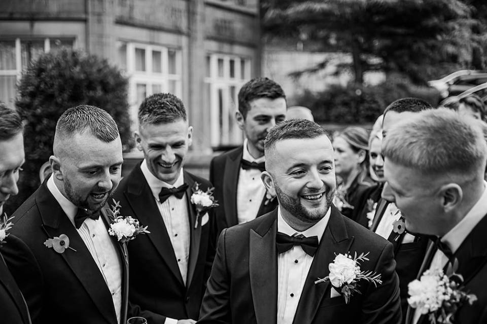 Groomsmen sharing a moment