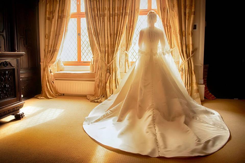 Guest-of-honour standing by window