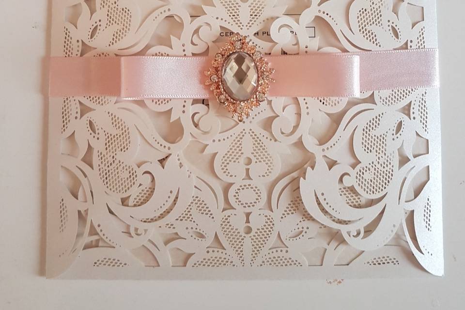 Laser cut with bow/diamante
