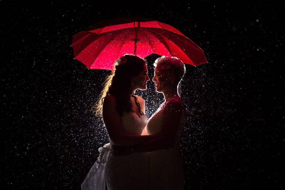 Brides Raining Umbrella