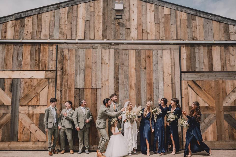 Wedding party by the barn