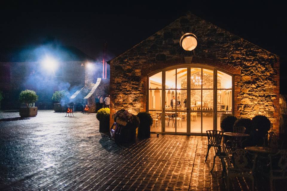 Orangery at night with brazier