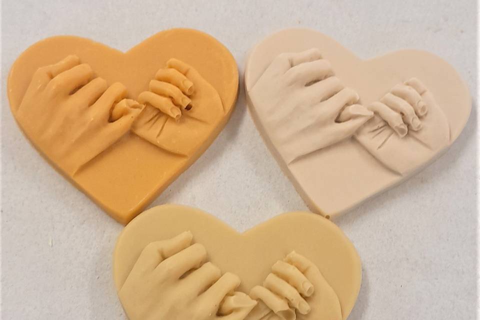 Couple hands heart chocolate