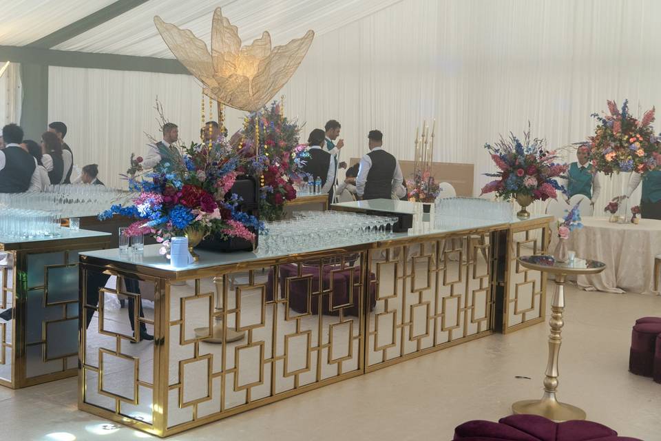 Gold lattice wedding bar in a marquee