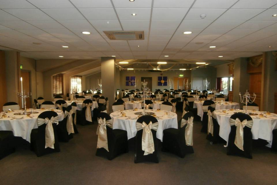 The Essex Golf & Country Club Black Stretch Lycra Chair Covers with Light Antique Tafetta Sashes