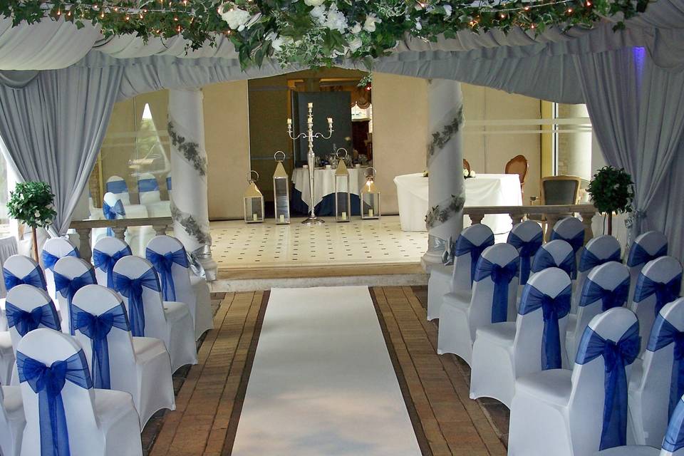 White stretch lycra chair covers with cobalt blue sashes