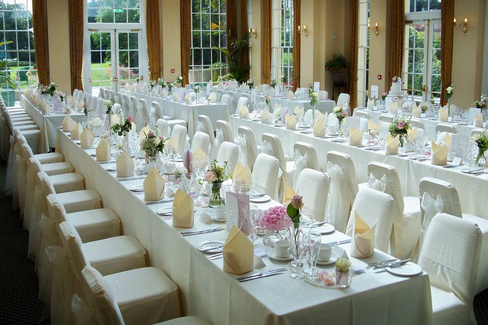 The Lawn Ivory Linen Chair Covers with Ivory Organza Sashes