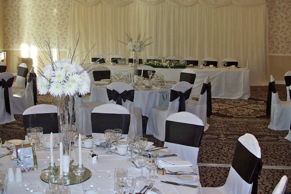 Shendish Manor White Linen Chair Covers with Black Satin Sashes with Starlight Backdrop Light Curtain