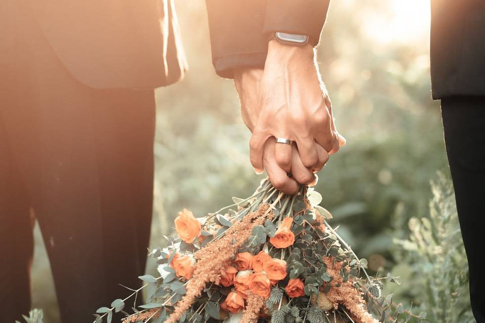 Two hands with flowers