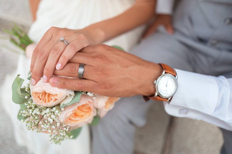 Hands with flowers and rings