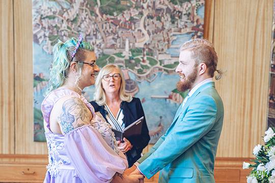 Bride and groom hold hands