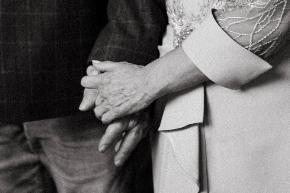 Holding hands at ceremony