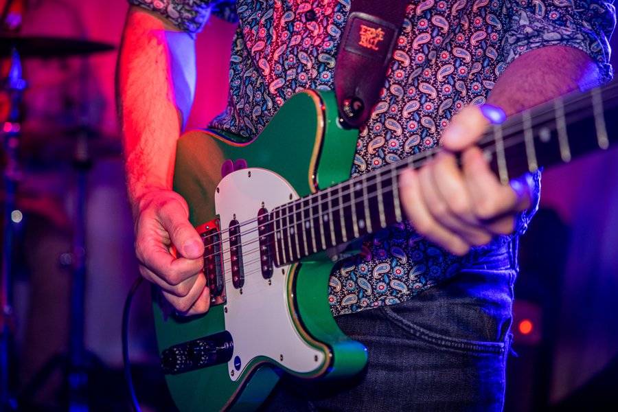 Musician playing a guitar