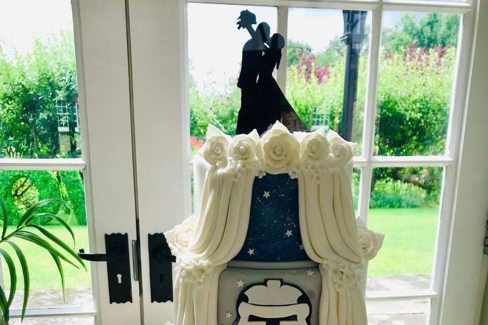 Themed fondant wedding cake.