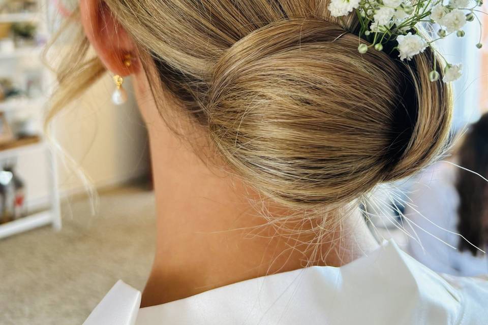 Sleek bridesmaid bun.