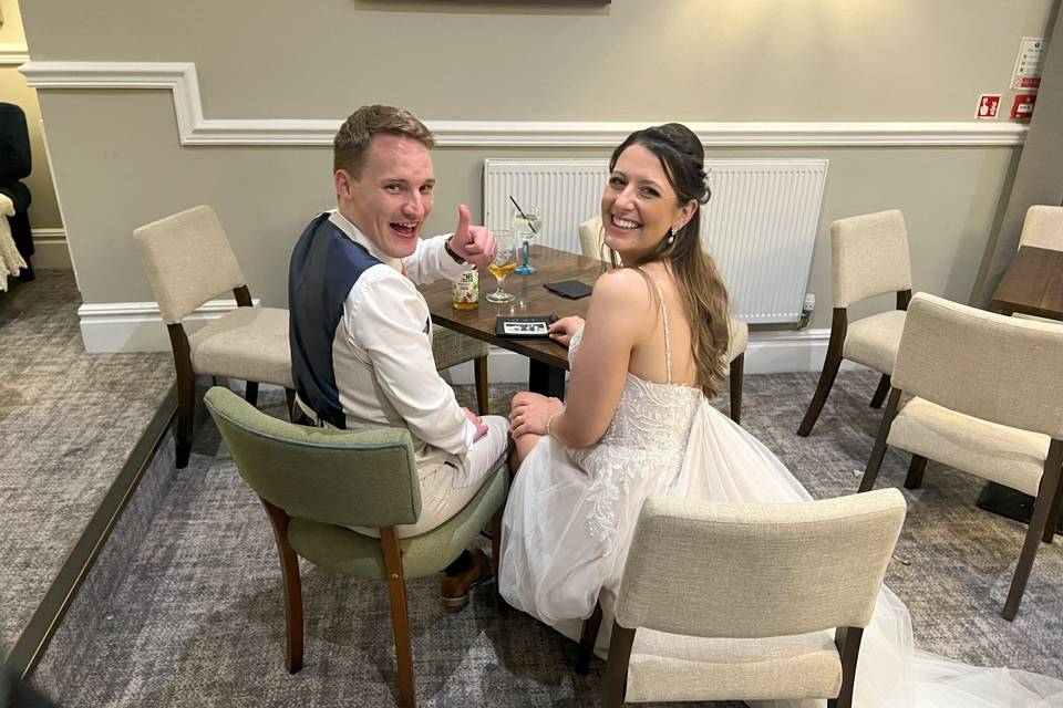 Bride and groom with guestbook