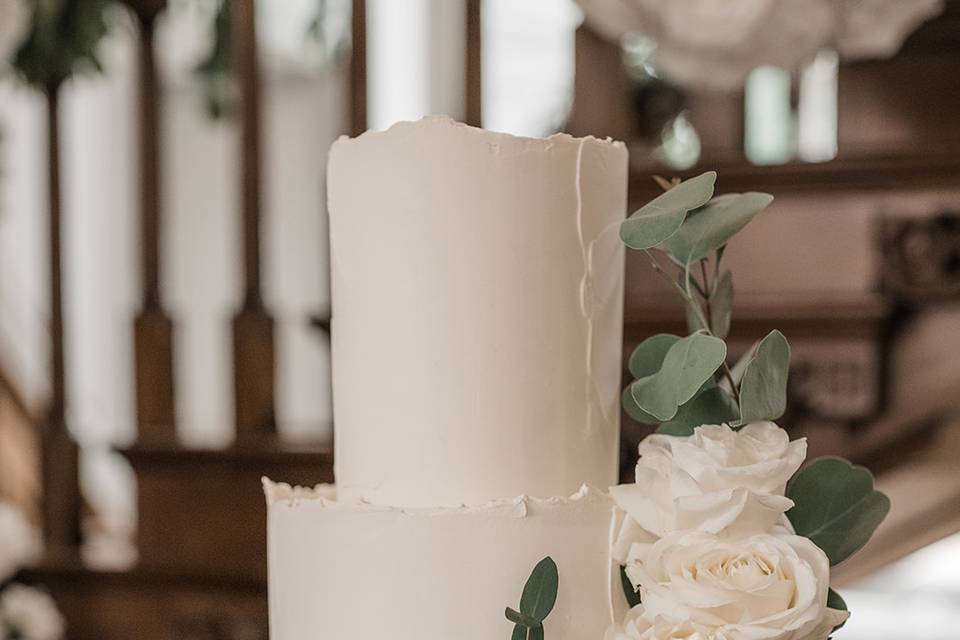 White wedding cake with rose