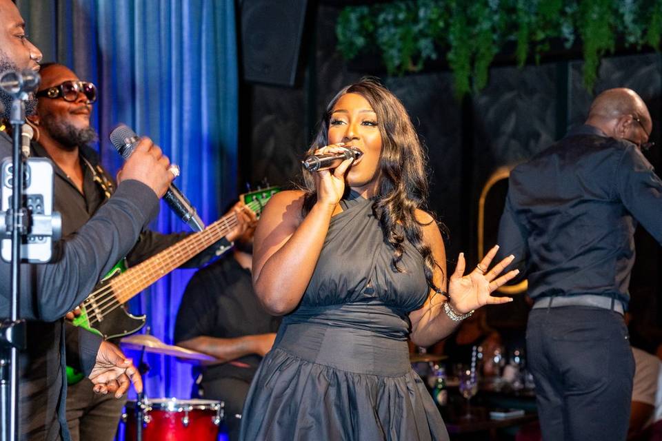 Female singer in blue dress