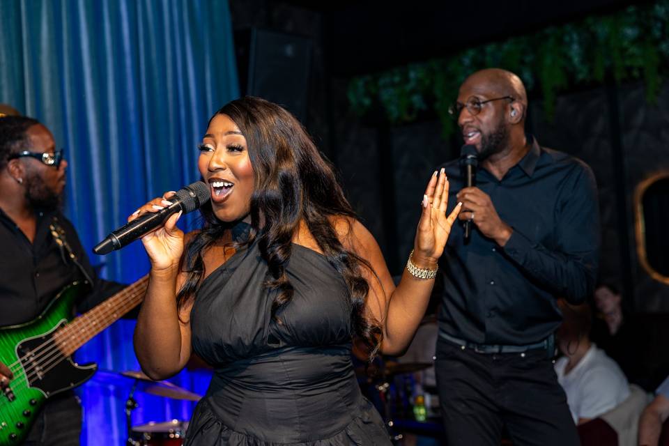 Female vocalist performing with band