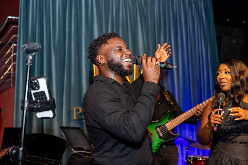 Male soloist singing into mic