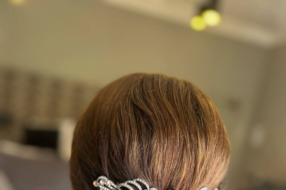 Low bun with hair piece