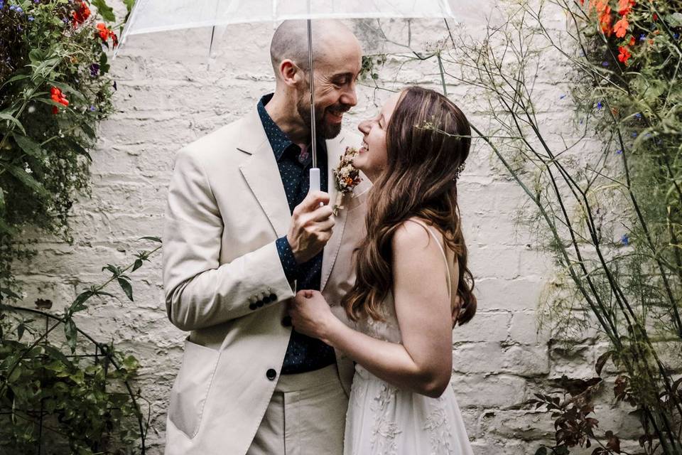 Bride & Groom under umbrella