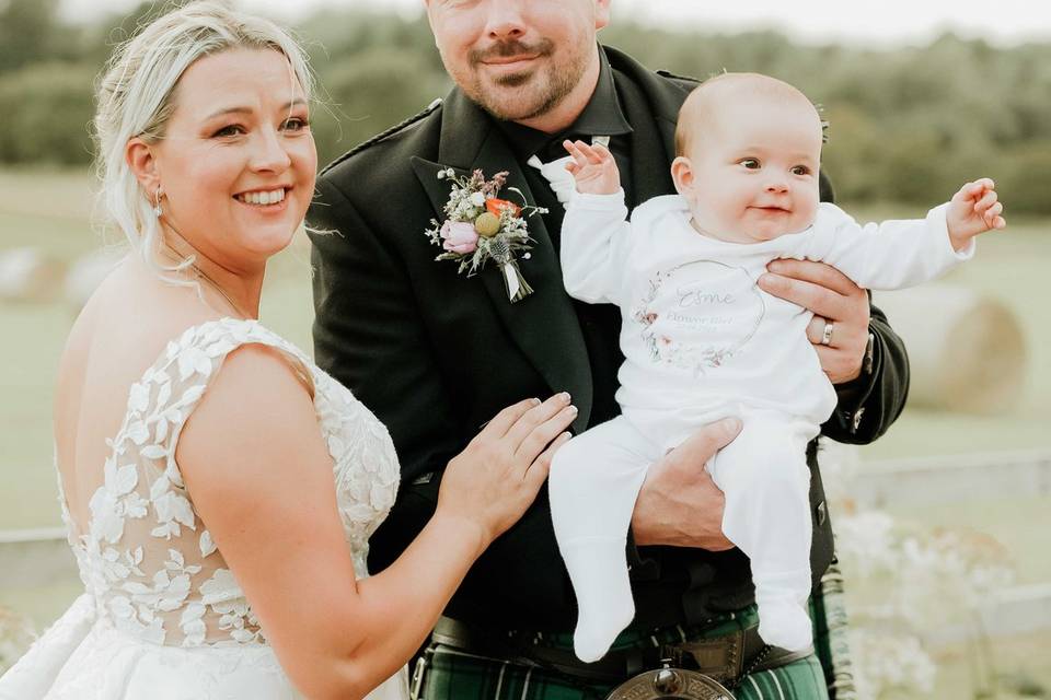 Bride, groom and baby