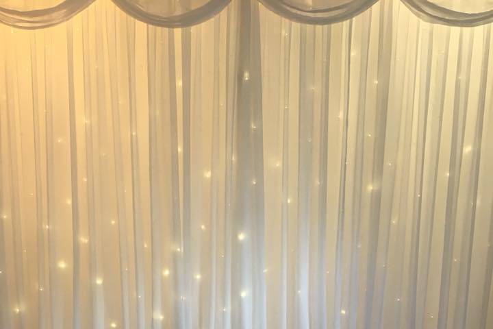 Star backdrops with pearl chair covers