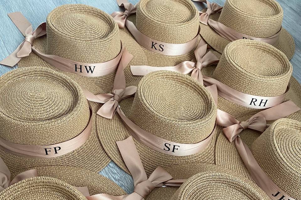 Personalised straw hats on the table